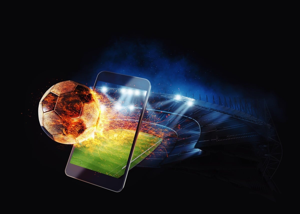 fire football in phone demonstrating sports betting
