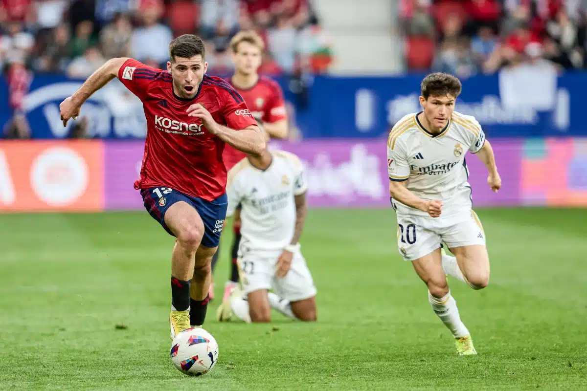 Jesús Areso of Osasuna and Arda Güler of Real Madrid seen in action during Osasuna and Real Madrid