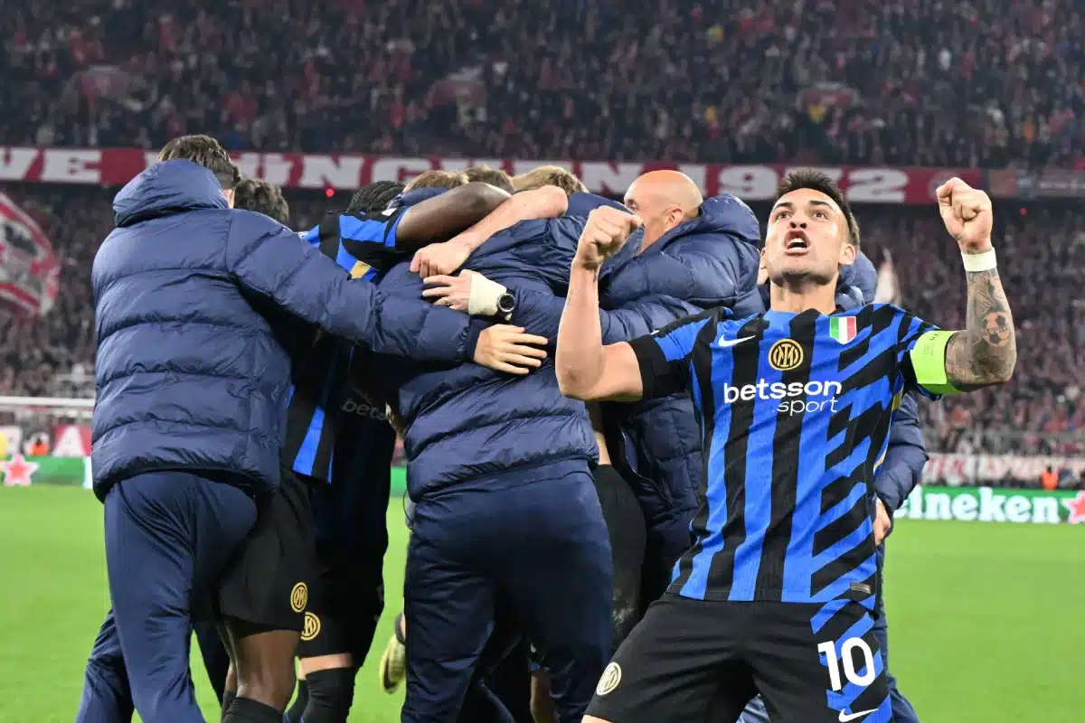 Inter's Lautaro Martinez, right, celebrates after the Champions League quarterfinals first leg soccer match between FC Bayern Munich and Inter Milan, at the Allianz Arena in Munich.