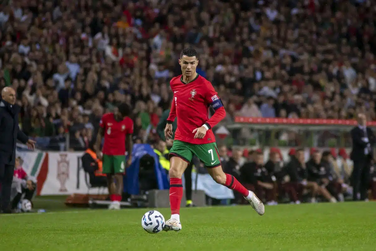 Cristiano Ronaldo drives the ball during the UEFA Nation League match between Portugal and Poland at Dragão Stadium.