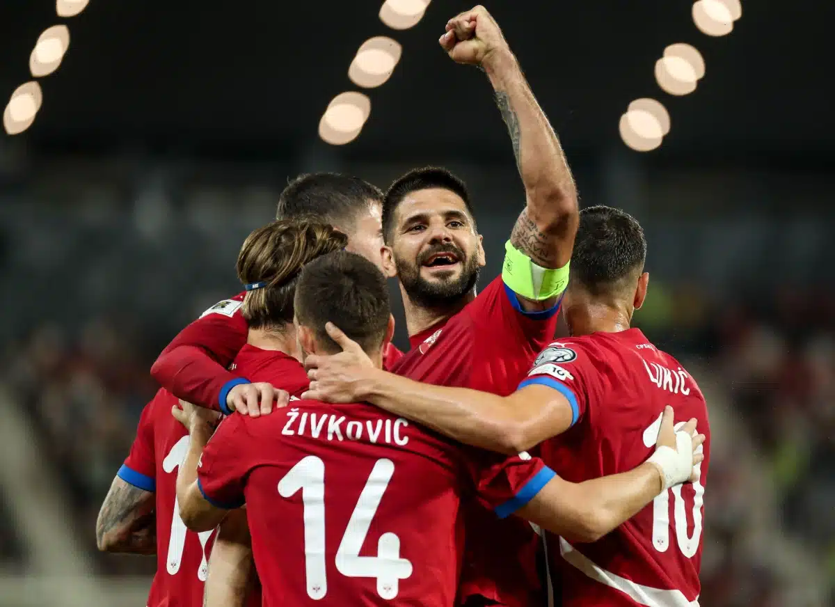 Aleksandar Mitrović of Serbia celebrates his second goal surrounded by teammates, 2025