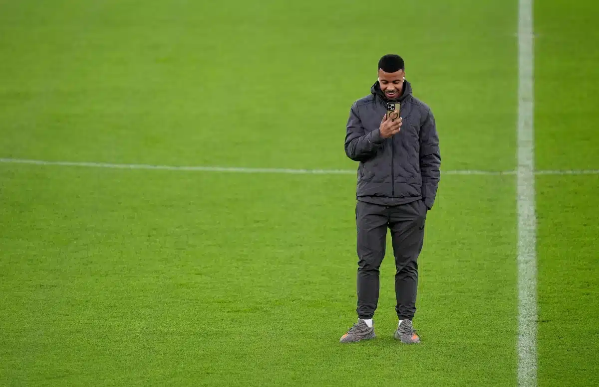 Hamza Igamane inspects the pitch before a press conference at Old Trafford, Manchester